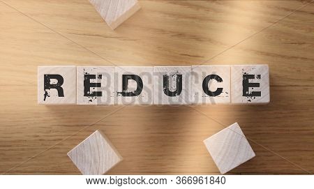 Reduce Word Written On Wood Block. Reduce, Reuse And Recycle Ecological Usage Comsumption Minimizati