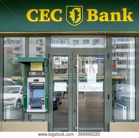 Bucharest/Romania - 05.16.2020: CEC bank branch with a ATM machine at the entrance. CEC Bank, is a state-owned Romanian banking institution.