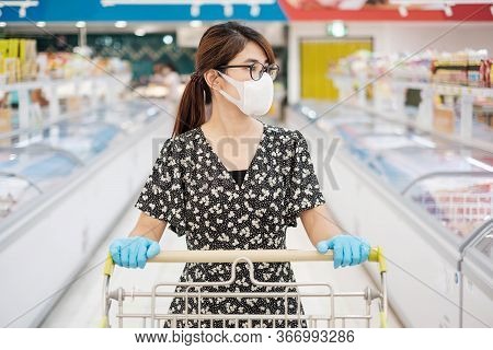 Asian Woman Wearing Protective Mask And Nitrile Gloves During Shopping In Supermarket Or Grocery, Pr