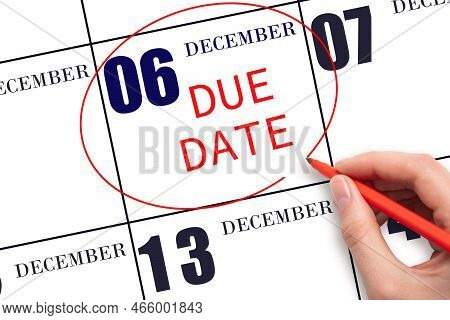 6th Day Of December. Hand Writing Text Due Date On Calendar Date December 6 And Circling It. Payment
