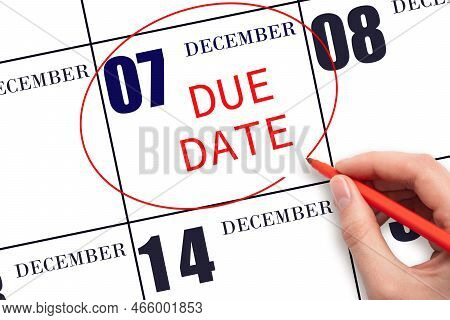 7th Day Of December. Hand Writing Text Due Date On Calendar Date December 7 And Circling It. Payment