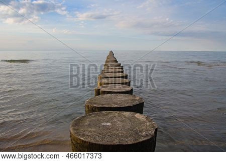 Breakwater On The Beach Of The Baltic Sea Near Rewal. Poland