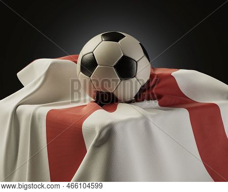 A Regular Soccer Balls Resting On A England Flag Draped Over A Plinth On An Isolated Studio Backgrou