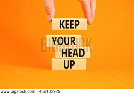 Keep Your Head Up Symbol. Concept Words Keep Your Head Up On Wooden Cubes. Beautiful Orange Table Or