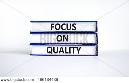 Focus On Quality Symbol. Concept Words Focus On Quality On Books On Beautiful White Table White Back