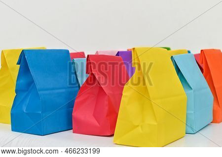 Set Of Colorful Shopping Folded Paper Bags On White Background. Paper Shopping Bags Mockup, Blank Re