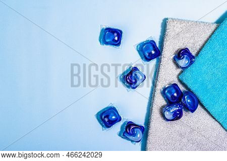 Machine Washing Concept. Capsules With Detergent, Soft Towels, Winter Freshness. Laundry Pods