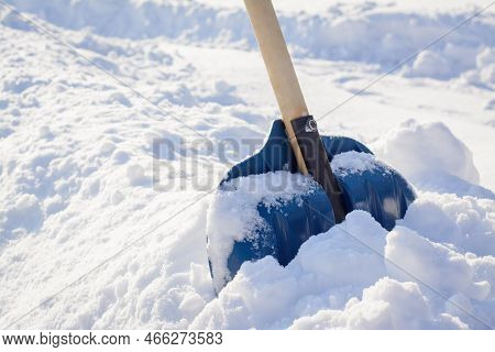 Cleaning Snow After A Snowstorm In Winter. Snow Shovel In Big Snowdrift Before Removing Snow In The 