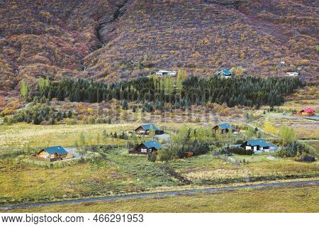 Icelandic Cottages In The Middle Of Green Hills