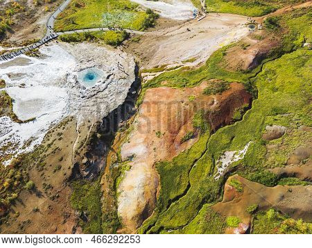 Vibrant Green Lands Surrounding The Hot Springs And Geyser Strokkur In Iceland