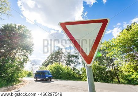 Give Way Sign On A Beautiful Sunset Background