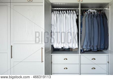 Male Wardrobe Furniture For Business Clothing Neatly Storage Organization. Man Closet With Garment