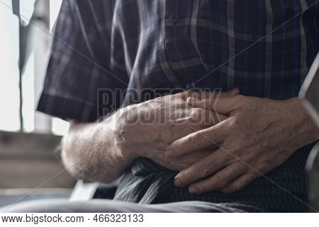 Asian Elder Man Suffering From Abdominal Pain. It Can Be Caused By Stomach Ache, Enteritis, Colitis,