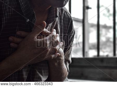Partial Silhouette Image Of Asian Elder Man Suffering From Central Chest Pain. Chest Pain Can Be Cau