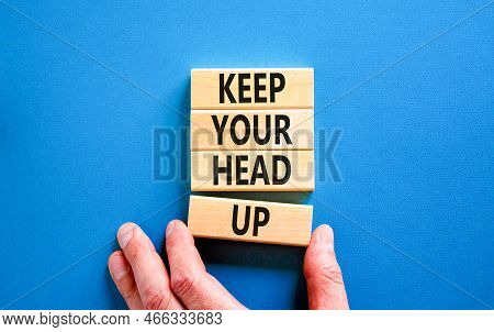 Keep Your Head Up Symbol. Concept Words Keep Your Head Up On Wooden Cubes. Beautiful Blue Table Blue