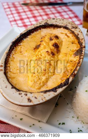 Quenelle, Speciality Of Lyon, Oval-shaped Dumplings Filled With Pike White Fish Served In Creamy Sau