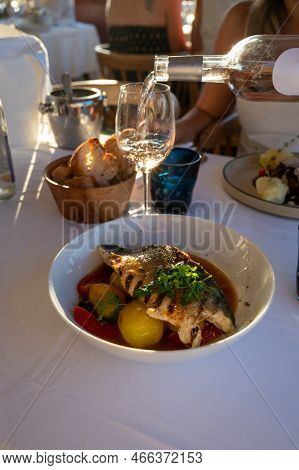 Provence Cuisine, Filet Of Seabass White Fish Served With Potatoes, Tomatoes And .bouillabaisse Jus