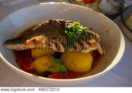 Provence Cuisine, Filet Of Seabass White Fish Served With Potatoes, Tomatoes And .bouillabaisse Jus