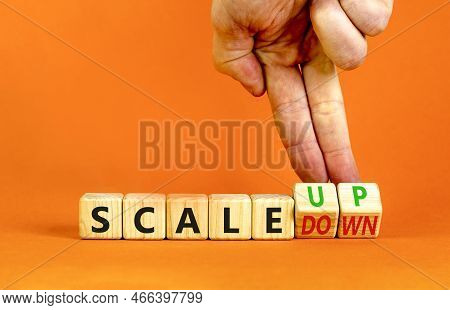 Scale Up Or Down Symbol. Concept Words Scale Up Scale Down Wooden Cubes. Businessman Hand. Beautiful