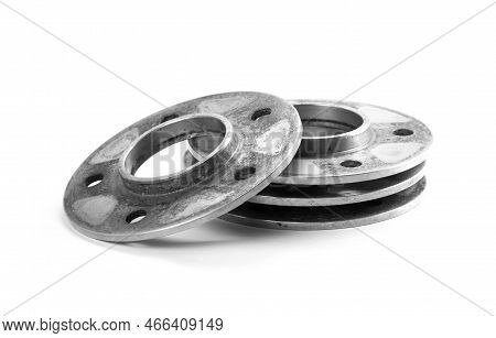 Used Aluminum Wheel Spacers. Four Through Spacers. Closeup Of The Isolate On A White Background.