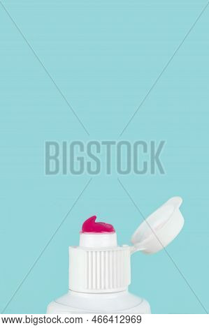 Toothpaste Squeezed Out From A Toothpaste Tube. Toothpaste Dental Care, Tooth Paste Close Up On Blue