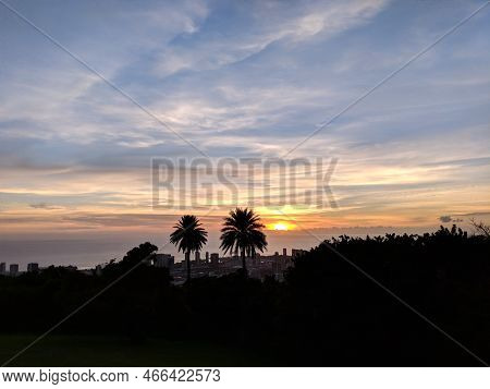 Sunset Through The Clouds Over The Ocean Seen From Tantalus Lookout - Puu Ualakaa State Park Past Tr