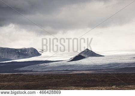Grey Clouds Rolling Over The Shore Of Iceland On A Moody Autumn Day