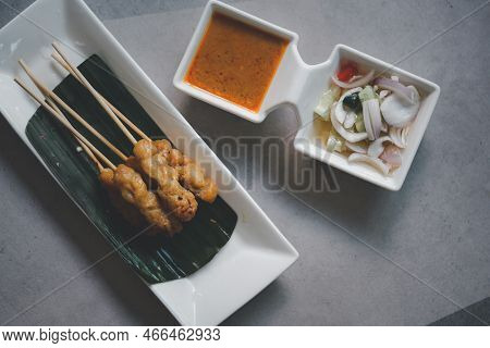 Moo Satay Grilled Pork Served With Peanut Sauce Or Sweet And Sour Sauce - Asian Food Concept Style