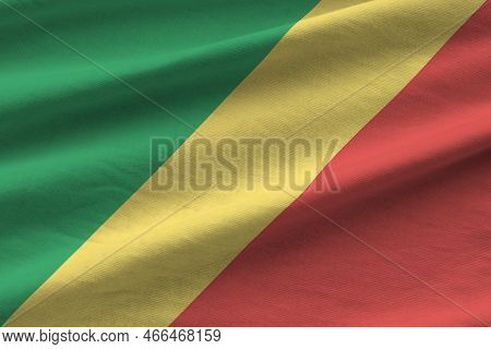 Congo Flag With Big Folds Waving Close Up Under The Studio Light Indoors. The Official Symbols And C