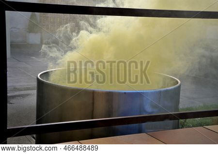 Hot Sulphurous Spa Treatments, In A Stainless Steel Barrel From Which Yellow Steam Rises. Flower Pot