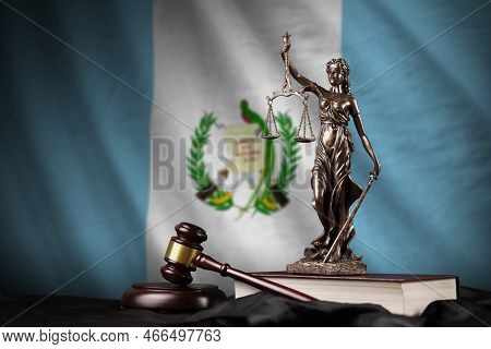 Guatemala Flag With Statue Of Lady Justice, Constitution And Judge Hammer On Black Drapery. Concept 