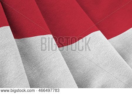 Indonesia Flag With Big Folds Waving Close Up Under The Studio Light Indoors. The Official Symbols A