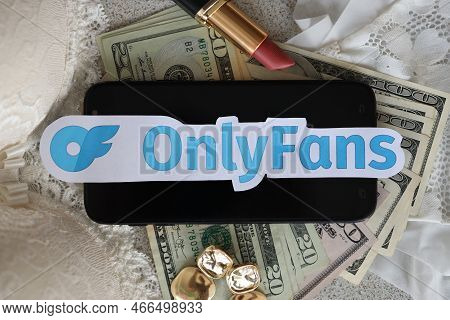 Ternopil, Ukraine - September 6, 2022 Onlyfans Paper Logotype Among Lipstick, Earrings And Women Lin
