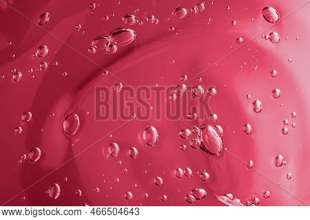 Trendy Color Of 2023 Viva Magenta. Close Up Macro Aloe Vera Gel Serum Cosmetic Texture Background Wi