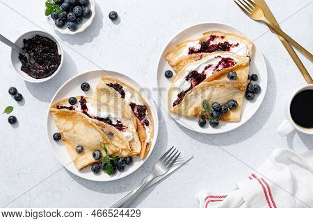 Crepes With Blueberry Jam, Ricotta Cheese And Fresh Berries. Pancakes For Breakfast. Top View