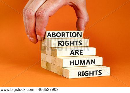Abortion Rights Symbol. Concept Words Abortion Rights Are Human Rights On Wooden Blocks. Businessman