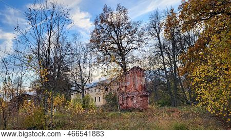 The Ruins Of An Ancient Manor In Autumn Time. The Castles Old Brick Walls With Yellow Trees Eleja Ma