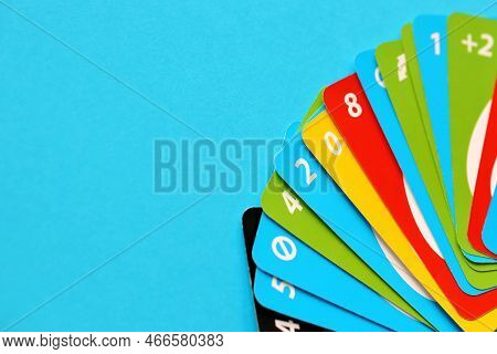 Ternopil, Ukraine - May 15, 2022: Many Colorful Uno Game Cards On Blue Background Close Up. Uno Is A