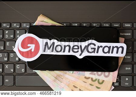 Ternopil, Ukraine - September 6, 2022 Moneygram Paper Logotype Lies On Black Laptop Keyboard With Uk