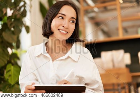 Young Beautiful Artist, Woman Drawing On Tablet With Graphic Pen, Smiling Happily