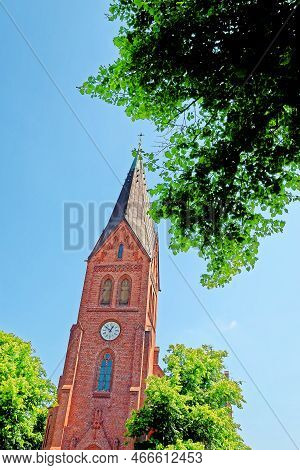 Evangelical Lutheran Church - The Neo-gothic Warnemunde Church Tower Rises Above The Baltic Coastal 