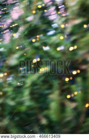 A Background Picture Of Festive Bokey Blurry Christmas Lights During The Holiday Season