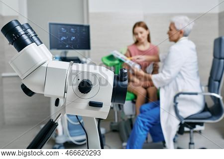 Close-up Of Colposcope, Over Background Gynecological Consultation Of Woman Patient With Doctor Gyne