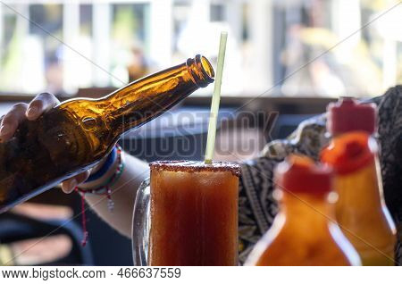 A Mexican Michelada With Dark Beer Drink
