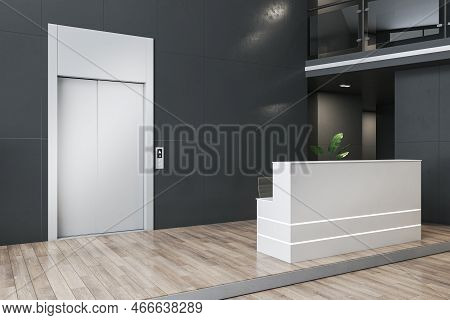 Clean Office Lobby Interior With Elevator And Reception Desk, Docorative Plant And Wooden Flooring. 