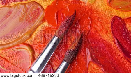 Brushes On Artist's Palette With Mixed Paints, Top View