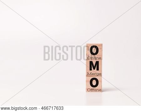 Combination Marketing Channel. Concept Of Online Merge Offline On Wooden Cubes.
