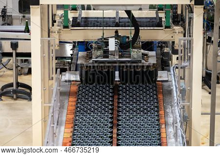Production Of Cremant Sparkling Wine In Burgundy, France. Automatically Powered Bottling And Riddlin