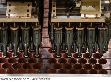 Production Of Cremant Sparkling Wine In Burgundy, France. Automatically Powered Bottling And Riddlin