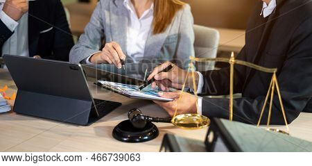 Business People And Lawyers Discussing Contract Papers Sitting At The Table. Concepts Of Law, Advice
